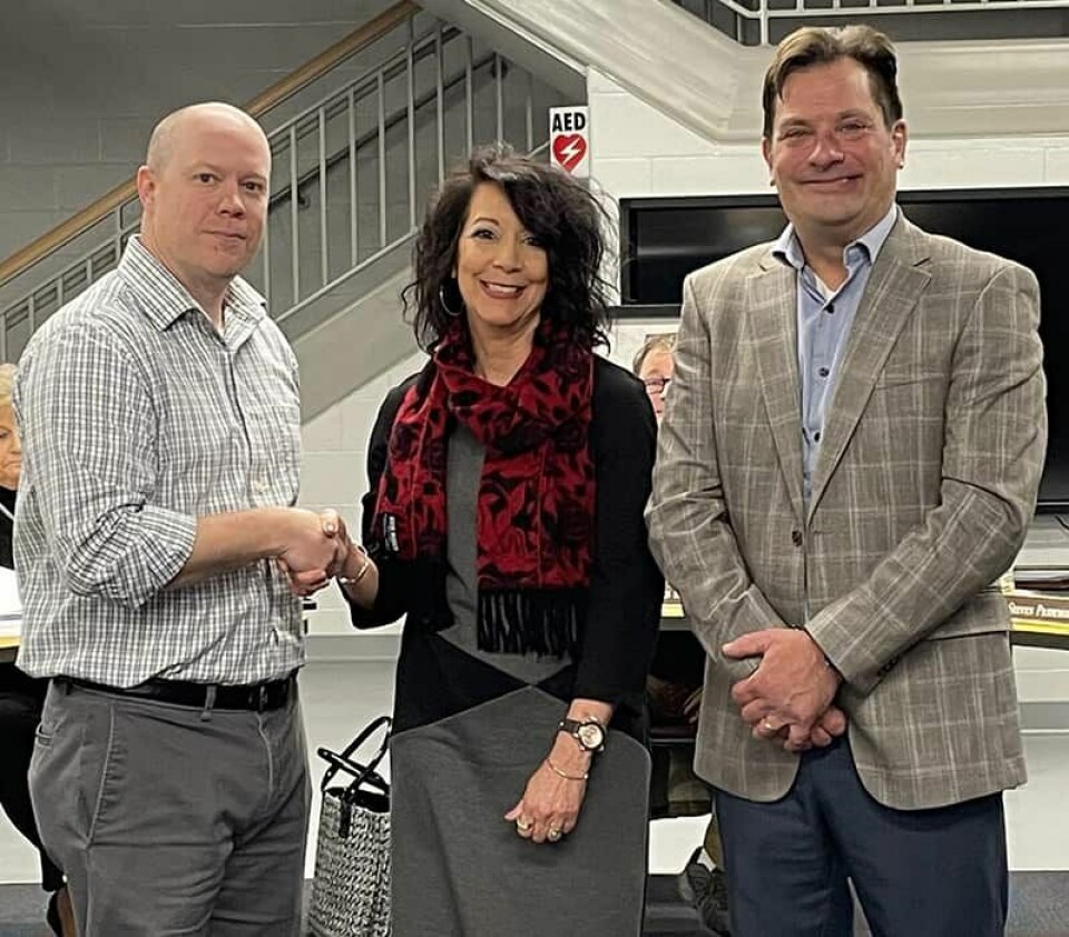 Carrollton Elementary Principal Matt Nicholas (left) congratulates Lisa Truman on being named the Coalition for Rural and Appalachian Schools (CORAS) teacher of the year at Carrollton Elementary.