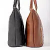Black and brown handbags displayed side by side.