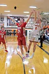 High school basketball players in action on the court.