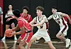 High school basketball players in action on the court.