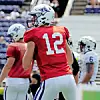 Football player in red jersey during practice.