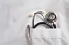Stethoscope and pen in a doctor's coat pocket