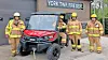Firefighters stand with a utility vehicle outside the York Township Fire Department.