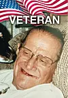 Smiling veteran with glasses and a dog.