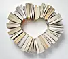 Books arranged in a heart shape.