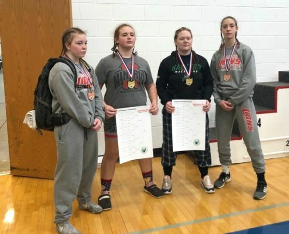 Four girls at state wrestling event: Kya McClish, Alaina Jackson, Olivia Daniels and Michaela Jackson. Alaina Jackson and Daniels were crowned state champions.