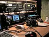 Amateur radio equipment with transceivers and headphones.
