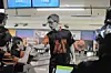 Bowling team member shakes hands with teammates.