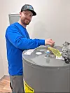Technician working on a water heater.