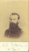 Sepia-toned portrait of a soldier with a beard in uniform.