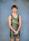 Young wrestler in green uniform with 'Medina' text