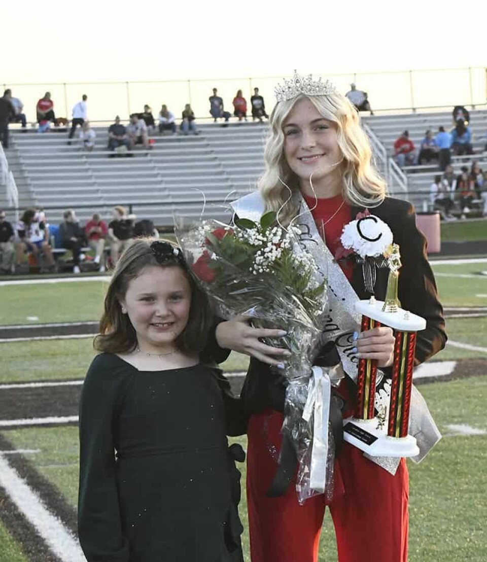 CCM/Carol McIntireEight-year-old Ella Zehentbauer (left) crowned Kaelyn Stewart 2024 Carrollton High School homecoming queen.