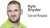 Kyle Snyder in a green shirt with a motivational quote.