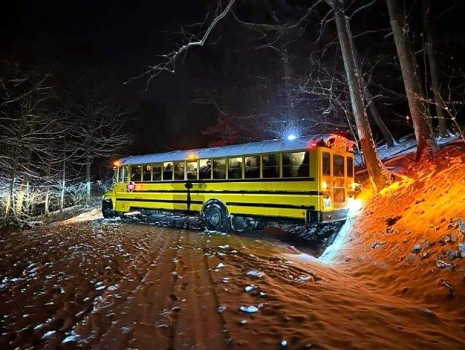 Submitted Photo One of the two church buses that became stuck in snow on Azalea Rd. slid backwards and blocked the highway.