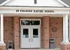 Entrance of St. Francis Xavier School with double doors.