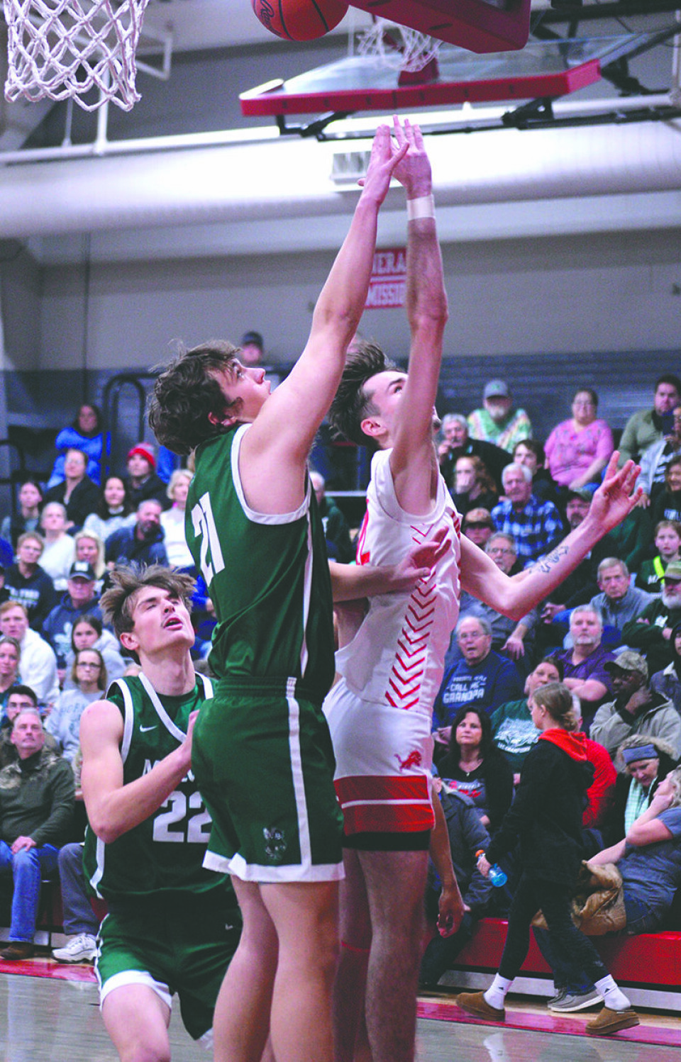 Submitted PhotoSeniors Mitch Minor (21,Malvern) and Garrett Gonzalez (22, Minerva) battle for a rebound.