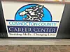 Sign for Coshocton County Career Center with a wolf logo.