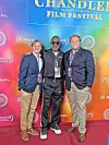 Three men pose at the Chandler International Film Festival.