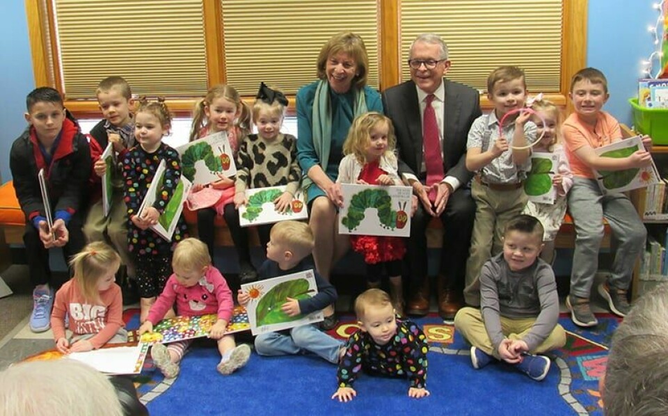 CCM/Thomas ClapperFran and Governor Mike DeWine are surrounded by children during a visit to the Malvern Branch Library Feb. 29. Fran read the book, “The Very Hungry Caterpillar” to children.
