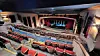 Theater auditorium with empty seats and a stage.