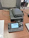 Ham radio equipment on a desk.