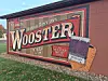 Mural welcoming visitors to Wooster, Ohio, with a paintbrush illustration.