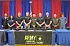 Group of individuals at an Army recruitment event.