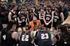 Basketball team in a huddle during a timeout.