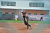 Softball player pitching on a field