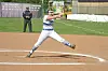 Softball pitcher throwing a pitch on the field.