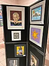 Student artworks displayed in an exhibition.