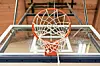 Close-up of a basketball hoop and backboard.