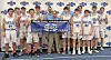 Youth basketball team holding a championship banner.