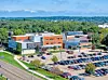 Aerial view of a modern educational facility with parking lot.