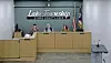 Lake Township board members seated at a meeting.