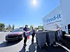 People participating in a document shredding event with a Shred-it truck.