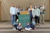 Family group photo in a community setting.