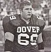 Football player in a black jersey with number 68 on the field.