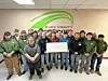 Group of students and staff with a large check at Knox County Career Center.