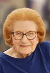 Elderly woman with glasses smiling