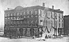 Historic brick building with decorative bunting.