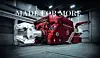 Large red industrial machine in a warehouse setting