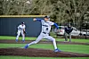 Baseball pitcher in action on the mound.