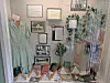 Vintage dress and historical documents in a museum display.