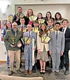 Students holding awards in a group photo.
