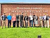 Group photo of Harrison County Sheriff's Office members outside their building.