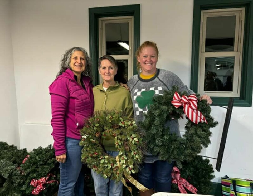 Submitted PhotoSuburban Garden Club members (from left:) Martha Petro, Linda Moreland and Angie Craft display fresh pine arrangements that will be part of the club’s Pine Art event in conjunction with the Carroll County Arts Center.