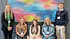 Five young adults posing in front of a colorful abstract painting.