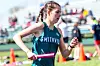 Runner from Smithville in a relay race holding a baton.