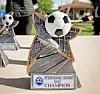 Trophy for soccer tournament with a soccer ball on top.